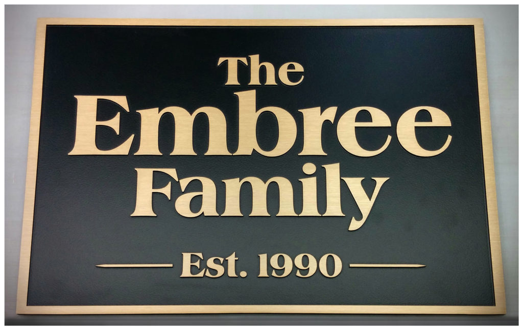 Cast bronze plaque with painted background