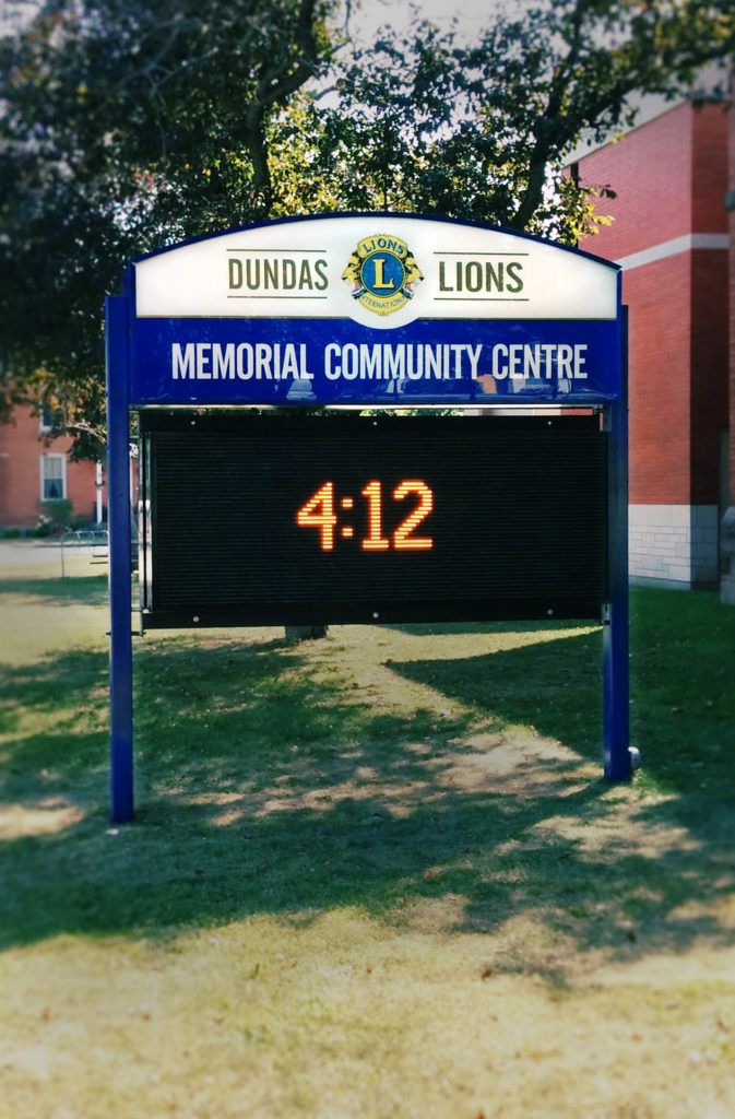 Lit monument sign with digital message board